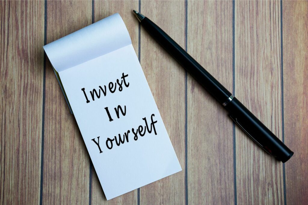 Notebook with motivational phrase: Invest in Yourself