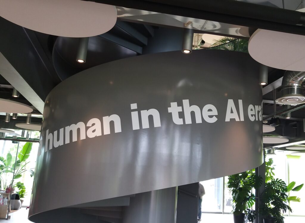 Written Human in the AI era- scale of the H-Farm foyer-Coaching with humans: Humans in the age of artificial intelligence