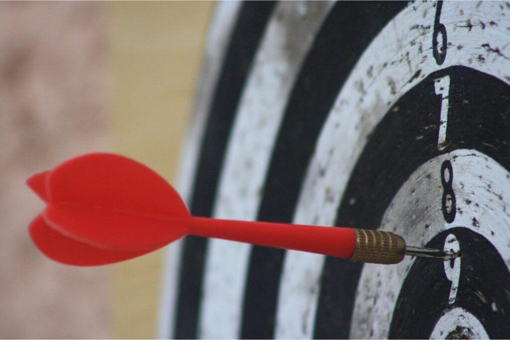 Dart hitting the clay target